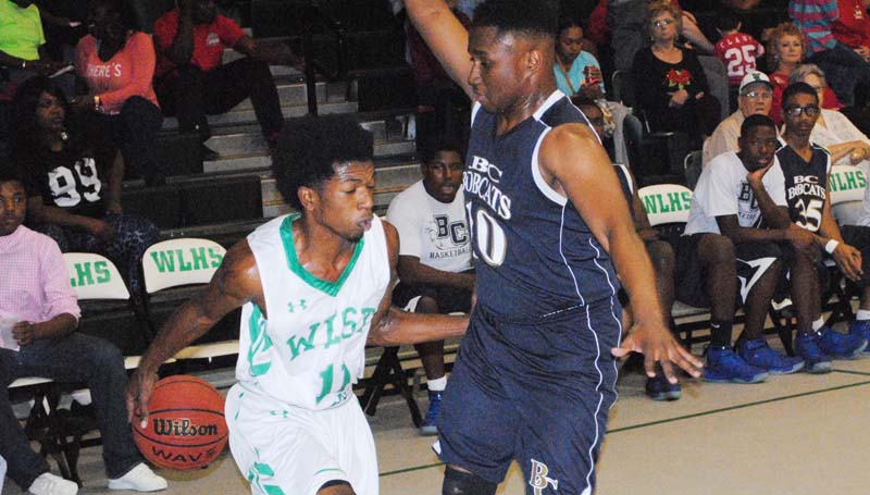 Daily Leader / Marty Albright / West Lincoln's Keshaun London (11) goes behind his back to elude Bogue Chitto's Tyler Brumfield (10) in Friday night action.