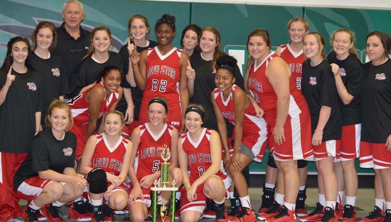 Daily Leader / Chris King / Loyd Star coach Gene "Moochie" Britt and his Lady Hornets gladly pose with Lincoln Country girls trophy after knocking off the Bogue Chitto Lady Cats 57-55 Saturday.