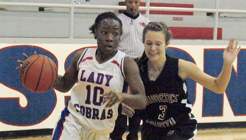 Daily Leader / Tracy Fischer / Wesson's Tashay Glasper (10) drives to the basket while being pressured by an Lawrence County defender Monday night.