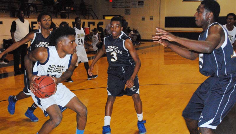 Daily Leader / Marty Albright / Franklin County's Ryan Johnson (10) looks for some help as Bogue Chitto's Henry Thomas (back), Lafredrick Dillon (3) and Malik Richardson (right) close in to deny the play Friday night.