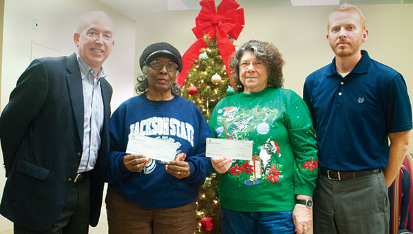Photo by Julia Miller / The Daily Leader and Bank of Brookhaven distributed checks to local food pantries as part of the annual Holiday Food Pantry Drive. Pictured are (from left) Shannon Aker, Bank of Brookhaven president; Flora Kelly, of the Greater Hope Foundation; Alice Methvien, St. Francis Catholic Church and St. Vincent de Paul Food Pantry; and Luke Horton, Daily Leader publisher.