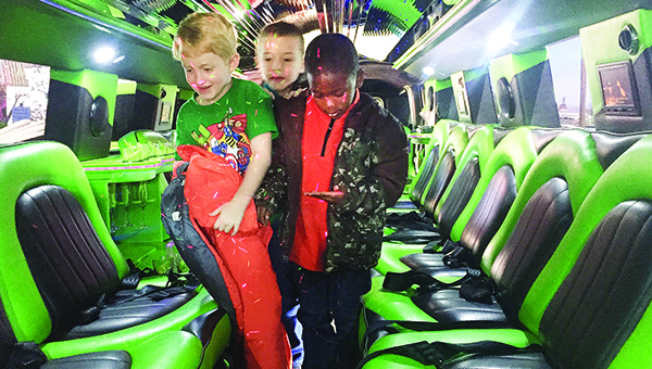 Photo by Luke Horton / Bogue Chitto Attendance Center students board a green limo after eating lunch at Fox’s Pizza Den Wednesday. The 65 students were treated to lunch after selling cookie dough as a fundraiser at the school. At least one student was heard shouting: “This is the best day ever.”
