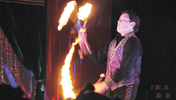 Photo by Aaron Paden / Alejandro Garcia juggles flaming torches to the awe of more than 190 children and their family Saturday night at the Star Family Circus held at the National Guard armory on Highway 84. The event has 16 acts, including trapeze artists, clowns and archery.