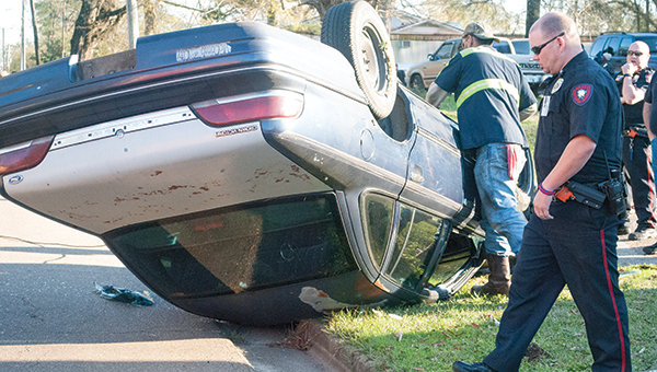 Photo by Kaitlin Mullins / A car accident Wednesday afternoon on Union Street sent one woman to the hospital after first responders extracted her from the flipped-over Crown Victoria.
