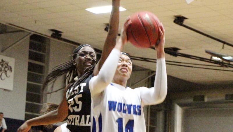 Co-Lin Media / Natalie Davis / East Central's Miracle Rushing (25) tries to block the shot by Tytiana Hall (14) in women's action Thursday night.