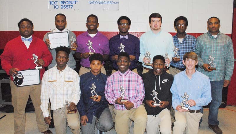 Daily Leader / Marty Albright / Lawrence County's football players receiving special awards at Thursday night's LCHS Banquet were (from left, kneeling) Charl'Tez Nunnery, Best Offensive Back, All-Region; Kemarcus Brown, All-Region, Most Improved; Quitten Brown, Most Valuable Offensive Player. All-Region Player of the Year, All-State Athlete of the Year; Kejuan Brown, Cougar Award, All-Region; Josh Stephens, Best Special Teams Player, All-Region; (standing) Blake Williams, Kenric Grandberry "Heart of a Champion" Award, All-Region; Brandon Armstrong, Best Offensive Lineman, All-Region; Marcus Atterberry, Best Receiver, All-Region; Marcus Kees, Best Defensive Lineman, All-Region; John Rutland, Scholar Award, Permanent Team Captain, All-Region; Mario Manning, All-Region; T-Tez Cole, Most Valuable Defensive Player, Permanent Team Captain, All-Region Defensive Player of the Year, All-State Linebacker.