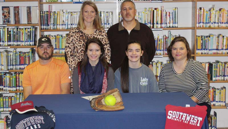 Daily Leader / Photo submitted / Bogue Chitto's pitcher/third baseman Alana Nettles has signed a softball scholarship to play for the Southwest Community College Lady Bears next year. Pictured with Alana is (from left) Jamie Nettles (father), Alece Nettles (sister), and Dana Nettles (mother). Standing in the back is Bogue Chitto assistant coach Denise Leggett (left) and Bogue Chitto softball coach Scott Leggett.
