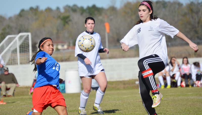 Daily Leader / Chris King / Loyd Star senior captain and defender Shelby Richardson prepares to steal the ball away from a Forest player in girls soccer action Saturday. The Lady Hornets and the Lady Bearcats finished with a 1-1 tie.