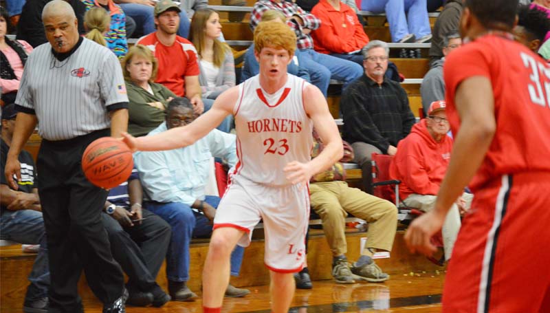 Daily Leader / Chris King / Loyd Star's Levi Redd (23) drives to the basket against Prentiss Tuesday night.