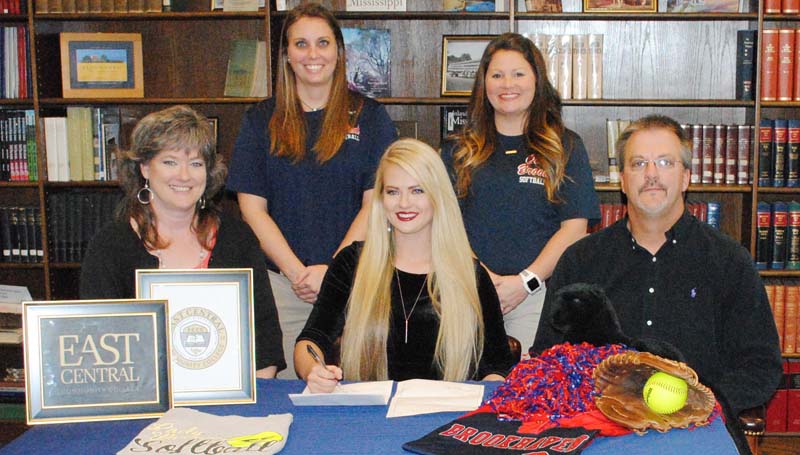 Daily Leader / Marty Albright / Brookhaven Lady Panthers pitcher Katherine Shell has signed a softball scholarship with the East Central Community College Lady Warriors. Present for the ceremony were her parents (seated) Lucy and Matt Shell; and (standing) Brookhaven softball coach Mandy Vinson and assistant coach Megan Bateman Case.