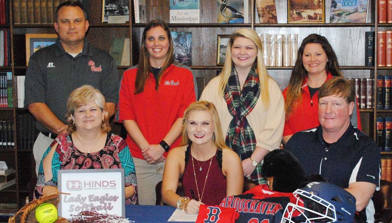 Daily Leader / Marty Albright / Brookhaven's catcher/infielder Haley Speaks has signed softball scholarship with the Hinds Community College Lady Bulldogs. Pictured with Haley is her mother Tiffany (left) and her father Jim Speaks. Standing is Brookhaven Athletic Director Tommy Clopton, Brookhaven softball coach Mandy Vinson, Alycen Speaks (sister) and Brookhaven assistant coach Megan Bateman Case.