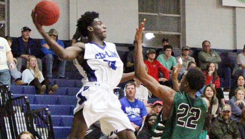 Co-Lin Media / Natalie Davis / Co-Lin's Chris Williams (12) makes the save for the Wolves in a double overtime thriller Thursday night in Mullen Gymnasium.