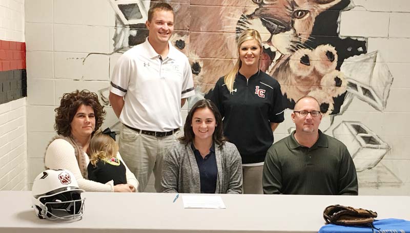 Daily Leader / Jana Harp / Lawrence County's pitcher Elizabeth Smith has signed a softball scholarship with the Copiah-Lincoln Community College Lady Wolves. Present for the ceremony were her parents (seated) Michael and Yvette Smith and sister Eden. Standing is Lawrence County assistant coach Marc Howard and Lawrence County head coach Meleah Howard.