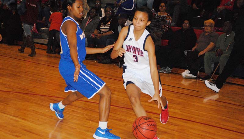 Daily Leader / Marty Albright / Brookhaven's Taylor Carter (3) drives past a Wingfield defender in girls' action Friday night.
