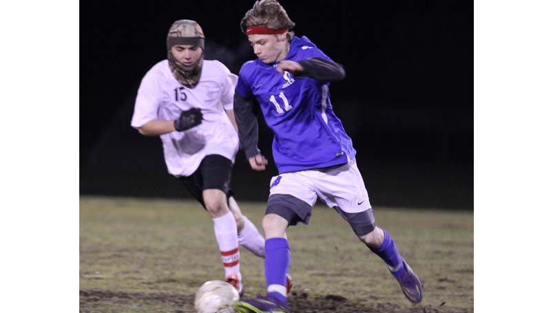 Daily Leader / Amy Rhoads / Loyd Star senior Ryan Nevels and Wesson's Steve Dennis battle for the ball in boy's soccer action Friday night at Hansel King Sportsplex.