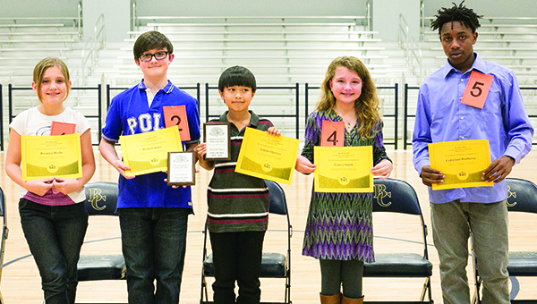 Photo by Kaitlin Mullins / Contestants in the Lincoln County Spelling Bee, left, on Monday were (from left) Breanna Meche of Bogue Chitto, Bennet Jones of Lipsey, Ashton Ogletree of Brookhaven Elementary, Gentry Smith of West Lincoln and Cedarious Brotherns of Alexander Junior High. Jones placed first with the winning word “tranquil” in the fifth round. Jones will go on to participate in the state competition March 15 at 10 a.m. at the MS Public Broadcasting Building. Ogletree placed second.