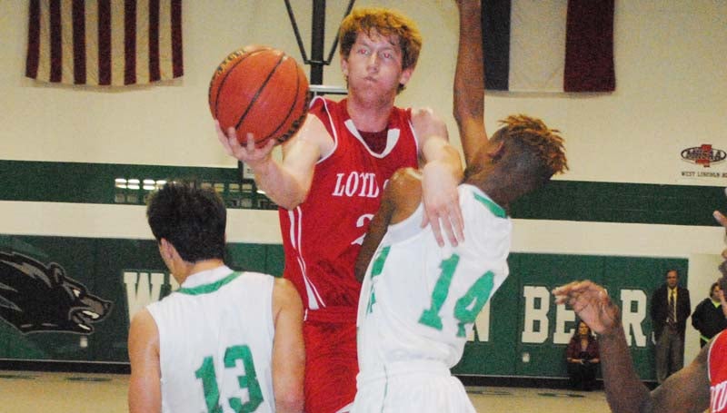 Daily Leader / Marty Albright / Loyd Star's Levi Redd (23) shoots a tough shot in between West Lincoln's Jayden Rushing (13) and Donterrius Taylor (14) in boys action Tuesday night at Jack Case Gymnasium.