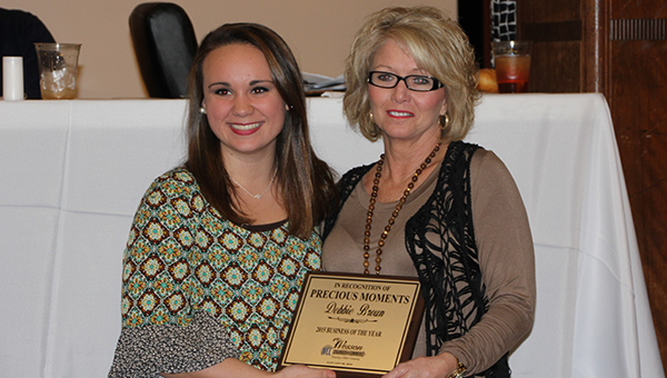 Photos by Alex Jacks / Mary Beth Munn (left) presents Debbie Brown, of Precious Moments Learning Center, with Business of the Year award.