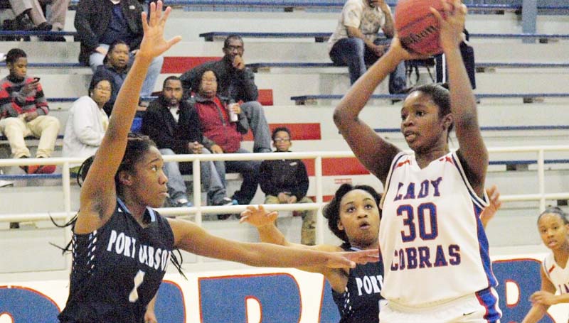 Daily Leader / Erich Fischer / Wesson Jashia Smith (30) looks for an open teammate while being double-teamed by Port Gibson JaQuita Mccay (1) and Glendolin Watson (20) Wednesday night.