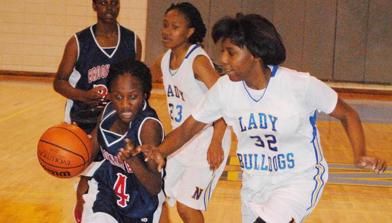 Daily Leader / Marty Albright / Brookhaven's Miyah Miller (4) drives to the basket against Natchez in girls' action.