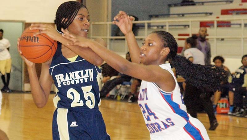 Daily Leader / Tracy Fischer / Wesson's Alaysha Vaughn (24) apply defensive pressure on Franklin County's Shamiah Amos (25) in girls' action Friday night.