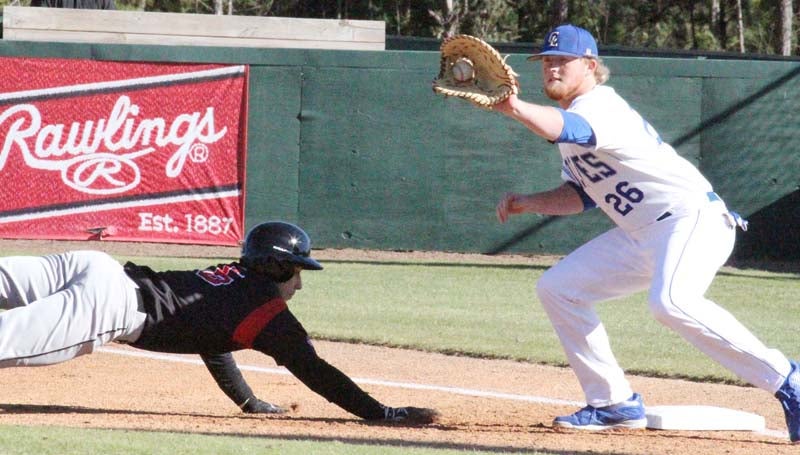 Co-Lin Media / Natalie Davis / Mississippi Delta's Cole Henson (5) scrambles back to first base under the tag of Co-Lin first baseman Kody Smith (26) Tuesday afternoon at Sullivan Field.