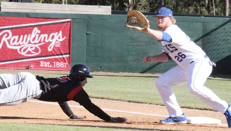 Co-Lin Media / Natalie Davis / Mississippi Delta's Cole Henson (5) scrambles back to first base under the tag of Co-Lin first baseman Kody Smith (26) Tuesday afternoon at Sullivan Field.