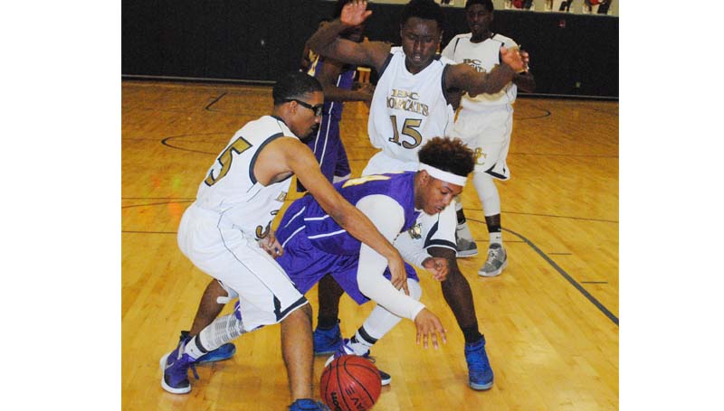 Daily Leader / Marty Albright / Bogue Chitto's Damarcus Godbolt (35) and Brandon Blackwell (15) apply defensive pressure on Mount Olive Thursday night.