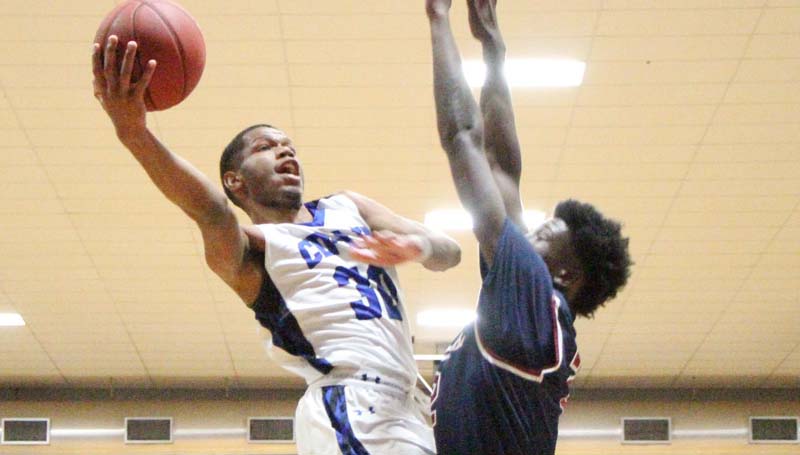 Co-Lin Media / Natalie Davis / Southwest's James Hawthorne tries to block the shot by Co-Lin's Darius Kennedy (30).