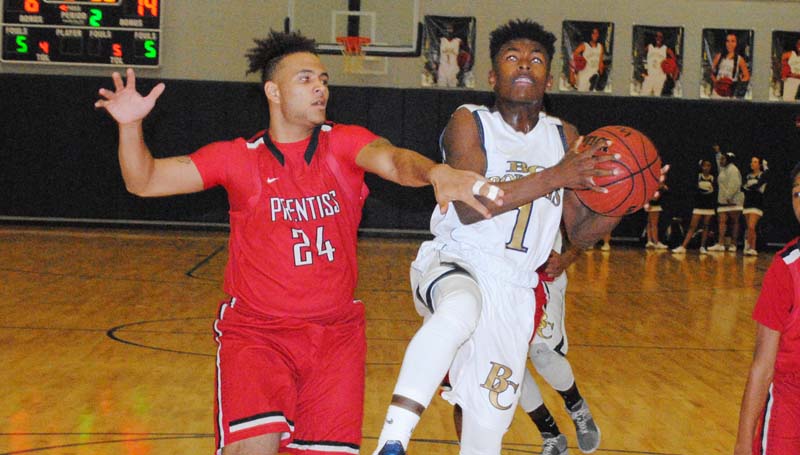 Daily Leader / Marty Albright / Bogue Chitto's D.J. Nunnery (1) is fouled by Prentiss Andrew Smith (24) while attempting a layup in boys' action Friday.