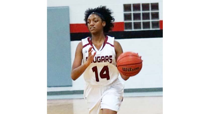 Daily Leader / File Photo / Lawrence County's Camryn Davis (14) drives the ball down the court against the North Pike Lady Jaguars Friday night.