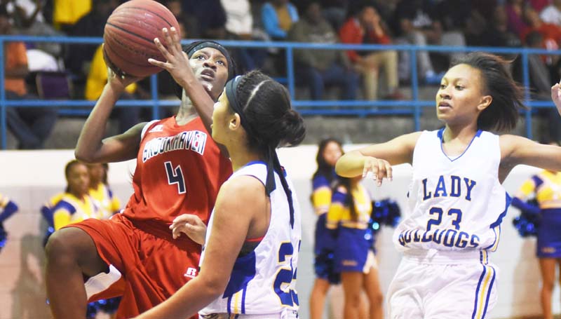 Natchez Democrat / Nicole Hester / Brookhaven's Miyah Miller scores a tough shot over Natchez Tuesday night in Region 6-5A tournament action in Natchez.