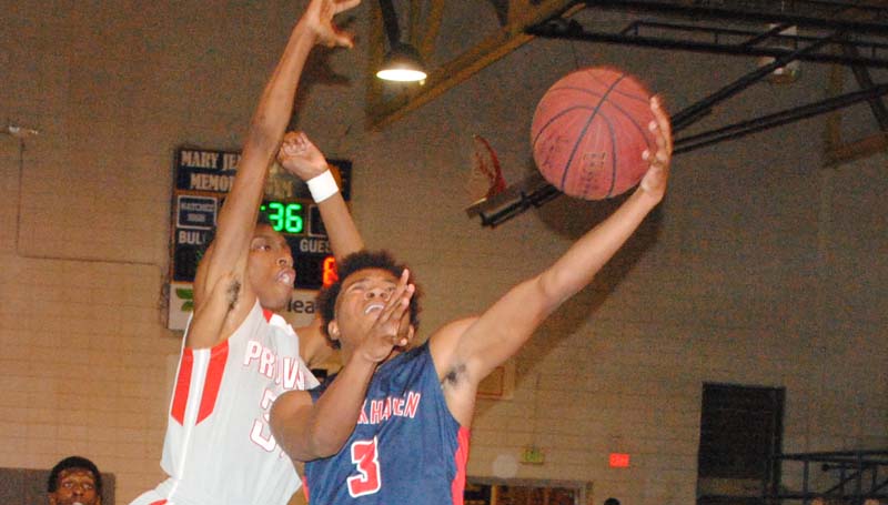 Daily Leader / Marty Albright / Brookhaven's Shon Blackwell (3) scores a tested layup against Provine's Anthony Johnson Friday night in the boys' Region 6-5A championship game at Natchez.