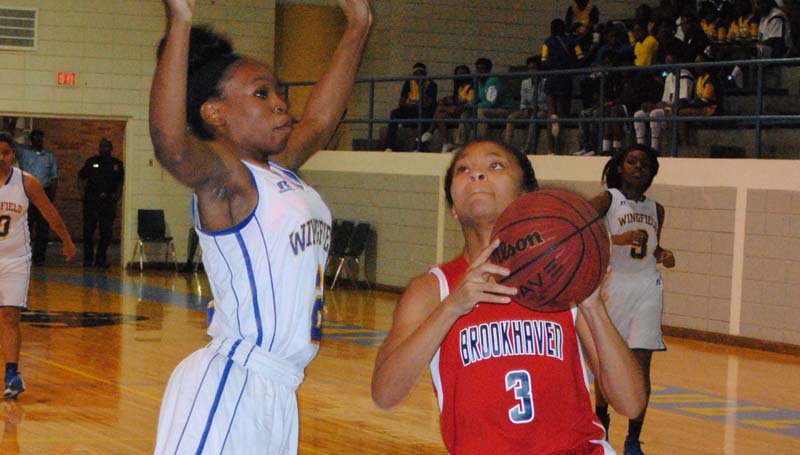 Daily Leader / Marty Albright / Brookhaven's Asia Byrd drives to the basket to score against Wingfield Friday night in the girls' consolation game.
