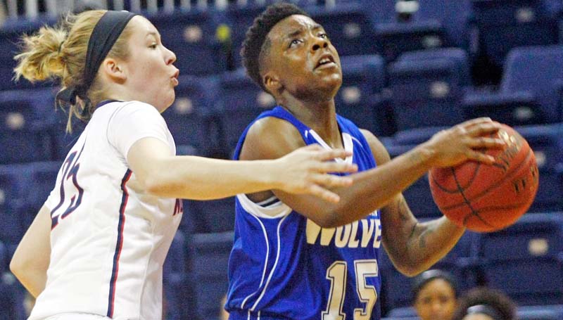 Co-Lin Media / Photo courtesy of JUCOWeekly / Co-Lin point guard Alexis Collins (15) blows past Northwest's Hayley Davis (25) for the layup in the opening round of the MACJC State Tournament at Itawamba.