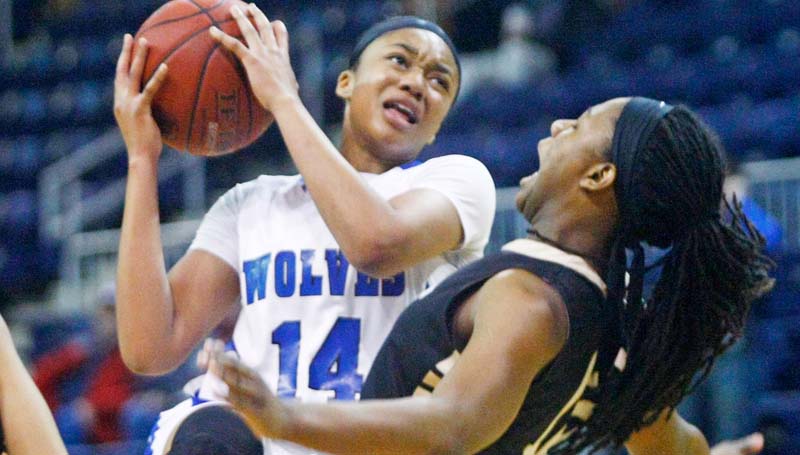 Co-Lin Media / Natalie Davis / Co-Lin Tytiana Hall (14) goes up for the shot guarded by East Central's Jelisa Pearson (15).