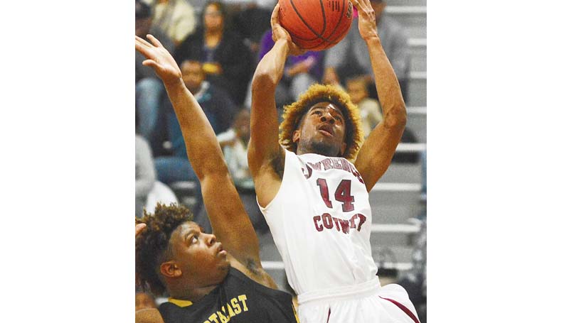 Daily Leader / Scott Boyd / Lawrence County's Gabe Lewis drives to the basket in Wednesday night's win over Northeast Jones in the 4A South State playoffs at Monticello.