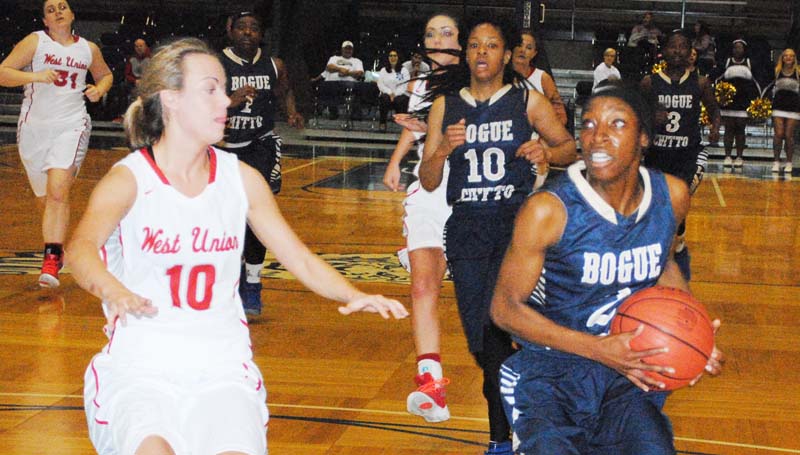 Daily Leader / Marty Albright / Bogue Chitto's Zariah Matthews (2) powers to the goal for a easy basket against West Union's Savannah Shirley (10) in Thursday's Class 1A girls' state tournament action at Jackson State University.