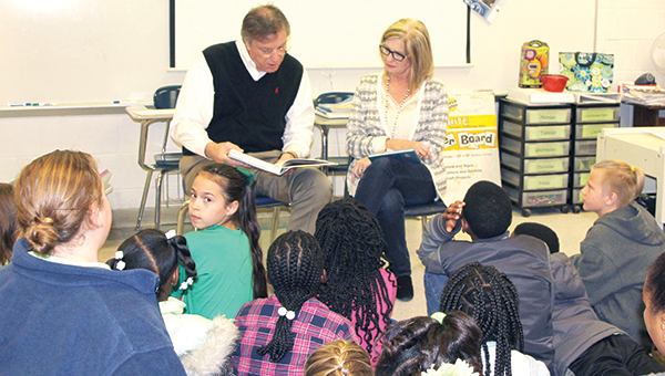 Photo by Alex Jacks / Mayor Joe Cox and his wife, Angie, stop by Brookhaven Elementary School to help celebrate Read Across America Day.