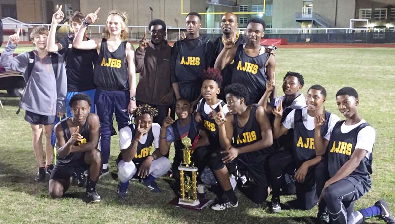 Daily Leader / Photo submitted / The Alexander Junior High boys' track and field team captured first place overall Tuesday as they hosted an invitational at King Field. Members of the team are (kneeling, from left) Toranta Williams, Jamie Finley, Caleb Edwards, Nick Williams, Kadavieun Hunter, JaQuarius Edwards, Quintaye Bates, and Gabrielle Burnett, (standing) Jacob Britt, Ethan Autrey, Samuel Mabile, Hurriah Lawerance, Piedro Wilson, Coach Alonzo Cameron and Jeremiah James.