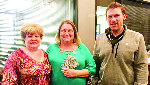 Photo submitted / Gail Thompson Kyzar of Bogue Chitto won $500 cash in First Bank’s “Win the Benjamins” Facebook Contest. Kyzar said, “My husband has been laid off from his job for quite a few months due to the economy and only recently went back to work. This is such a blessing.” She is pictured (center) with Brookhaven Branch Manager Connie Dunn (left) and Relationship Manger Eli Ferguson (right). The contest, sponsored on First Bank’s Facebook page, began in mid-February and ended on President’s Day. To comply with Facebook rules, participants were eligible by “liking” the First Bank page and commenting on a recent post. The winner was then chosen by random drawing. Both customers and non-customers, 18 and over, could enter the “Win the Benjamins” contest.