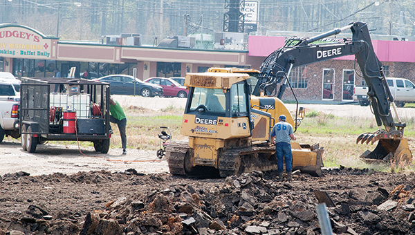 Photo by Aaron Paden / Workers are clearing the vacant lot near the intersection of Hwy. 51 and Brookway Boulevard for the new location of Jeff Wilson Chrysler Dodge Jeep Ram.