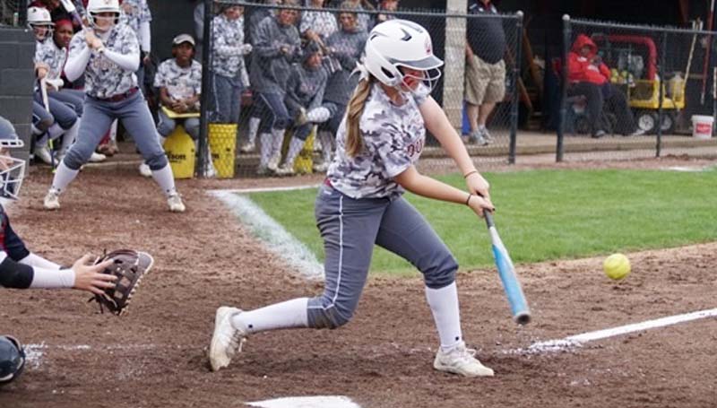 Daily Leader / Jana Harp / Lawrence County's Sydney Pevey (8) provides a big hit against Brookhaven Saturday. She finished with a double and a single.