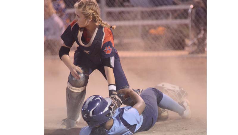Daily Leader / Marty Albright / North Pike's Janiah Talbert slides safely under the tag of Brookhaven catcher Haley Speaks in Tuesday night softball action.