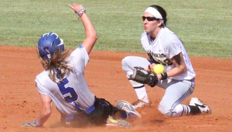 Co-Lin Media / Natalie Davis / Co-Lin's Mackenzie Byrd (5) slides safely into second base as East Central's Katlyn Duke bobbles the throw.