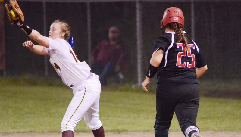 Daily Leader / Marty Albright / Enterprise first baseman Kinsey Dahlin stretches to record the out at first base before Loyd Star's runner Ali Gartman could reach.