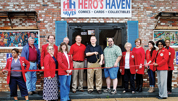 Photo by Kristi Carney / Hero’s Haven recently held its ribbon cutting. Personnel of the comics, cards and collectibles store located on Congress Street are Ken Powell, Charles Morris and Jason Reeves.