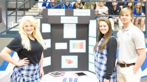 (From left) Whitney Moak, Maura Dunaway, Austin Smith and Morgan Barron (not pictured) presented a project on how the amount of exercise a person complete affects their BMI. The senior group won first place.