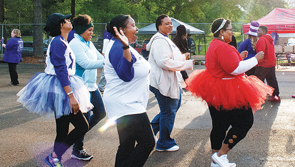 Photo by Aaron Paden / The rain stops as teams of community members walk to raise money and awareness for cancer research Friday.