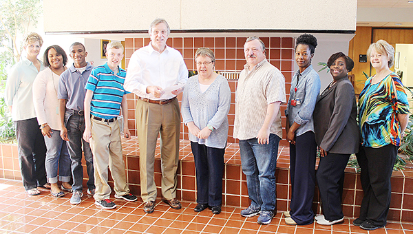 Photo submitted / Boswell Regional Center offers specialized program options to ones with Intellectual and Developmental Disabilities. These programs are designed to identify the necessary supports for successful community transition. Pictured are (from left) Cindy Womack, assistant director; Kimberly Bingham, QIPD at Mississippi Adolescent Center; Larry, service recipient; Aaron, service recipient; Mayor Joe Cox; P. Brown, service recipient; T. Cliburn, service recipient; Stephanie Thompson, health program specialist; Consuela Johnson, QIDP at MAC; and Donna Horton, director of client services at MAC.